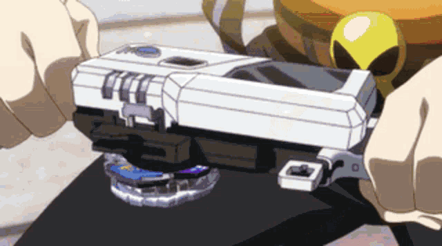 a person is holding a toy that looks like a gun and a yellow object