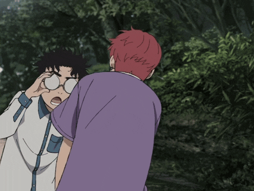 a boy with red hair and glasses stands next to another boy
