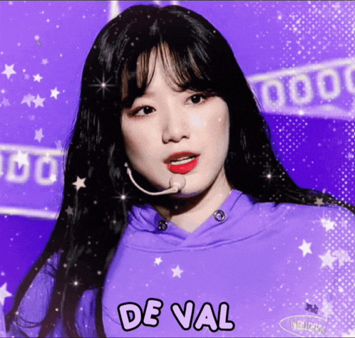 a girl in a purple hoodie with the word de val on the bottom