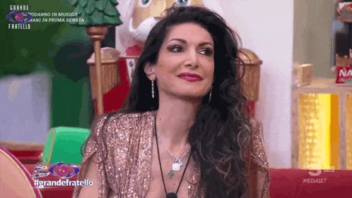 a woman in a sequined top is on a television show called grandefratello