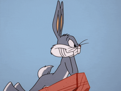 bugs bunny from the looney tunes show is sitting on a red box