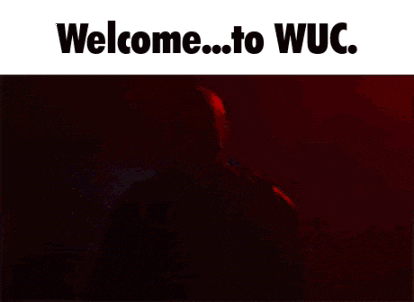 a man with a beard is standing in front of a red background with the words welcome to wuc written on it .
