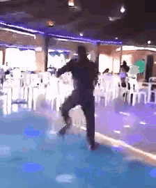 a blurry picture of a person dancing in a room