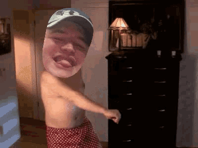 a shirtless man in polka dot underwear is dancing in a room
