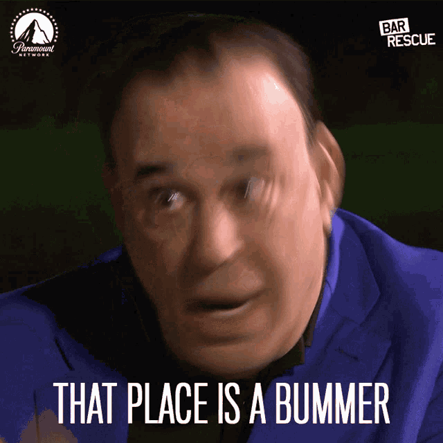 a man in a blue suit with the words that place is a bummer below him
