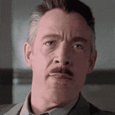 a close up of a man with a mustache