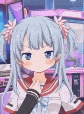 a blue haired anime girl with pigtails and flowers in her hair is making an angry face .