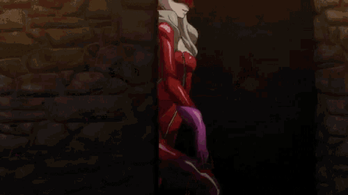a close up of a person wearing a red mask and a purple glove .