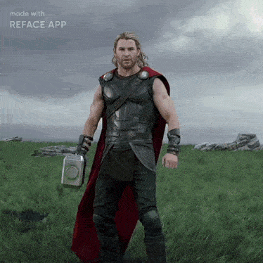 a man in a superhero costume is standing in a field with a reface app on the bottom right