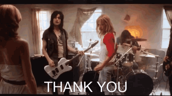 a group of people playing instruments in a room with the words thank you above them