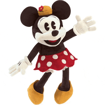 a stuffed minnie mouse wearing a red polka dot skirt