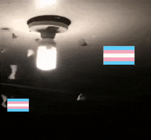 a light bulb hanging from the ceiling with a transgender flag in the corner