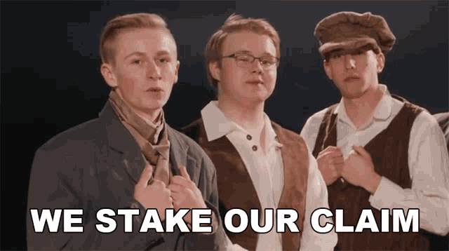 a group of men standing next to each other with the words " we stake our claim " above them