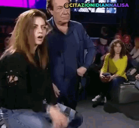 a woman is kneeling down in front of a man with the hashtag citazionidiannalisa