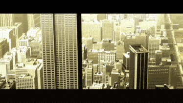 an aerial view of a city with tall buildings