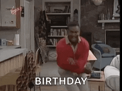 a man in a red sweater is dancing in a living room with the words `` birthday '' written above him .