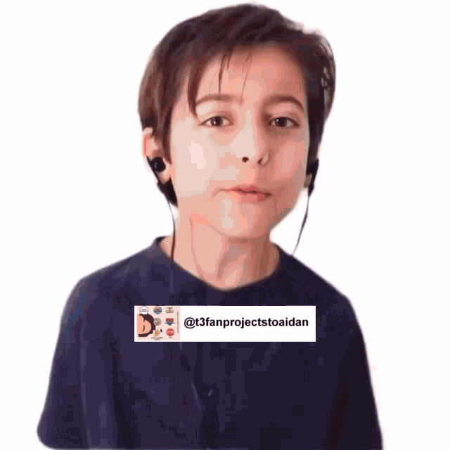 a young boy wearing headphones and a blue shirt is talking to someone .