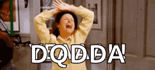 a woman in a yellow sweater is laughing with her hands in the air and the word dodda written above her .
