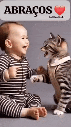 a baby is sitting next to a cat and they are hugging each other .