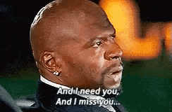 a bald man in a suit and tie is saying `` and i need you , and i miss you ... ''