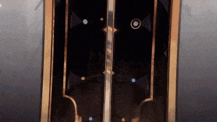 a dark room with a door that has a circle in the middle