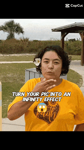 a woman in a yellow shirt is blowing a kiss