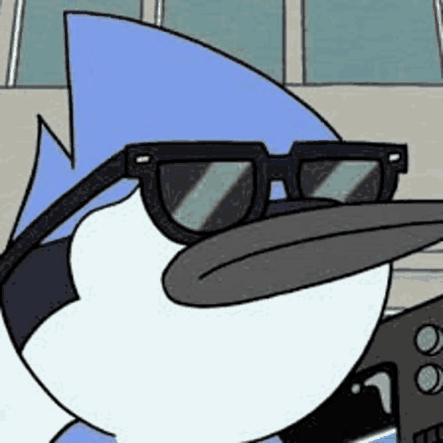 a cartoon bird wearing sunglasses is standing next to a camera .