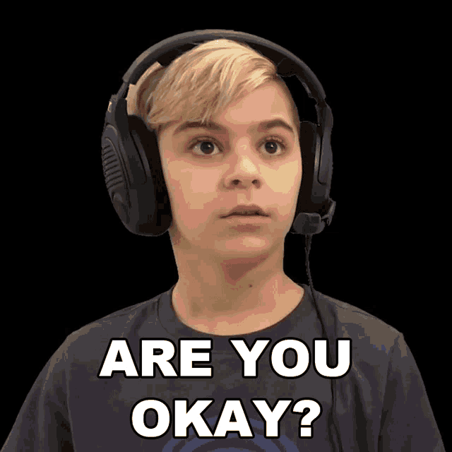 a boy wearing headphones and a shirt that says " are you okay "