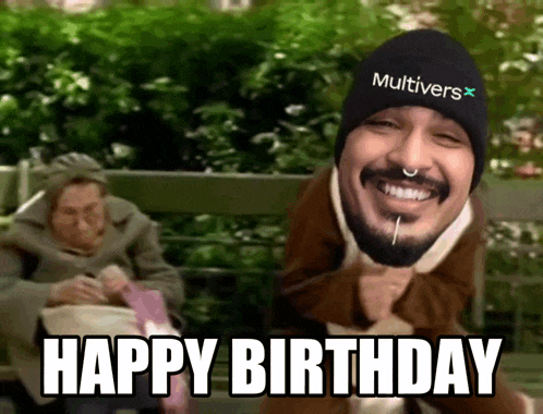 a man wearing a beanie that says multiversx on it says happy birthday