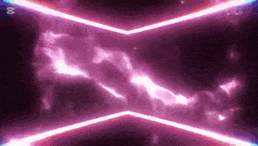 a purple light beam is coming out of the corner of a dark room .