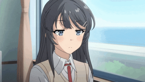 a girl with long black hair and blue eyes is wearing a white shirt and tie