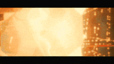 a blurred image of a fire with a few spots of light on it