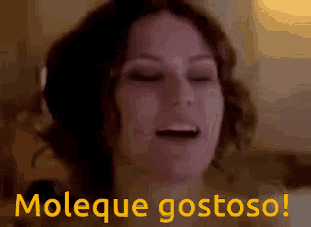 a close up of a woman 's face with moleque gostoso written in yellow