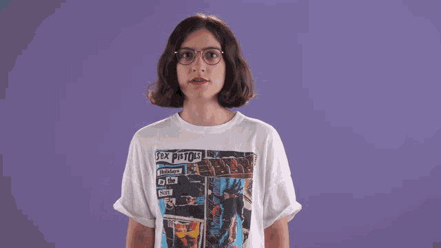 a woman wearing glasses and a sex pistols t-shirt