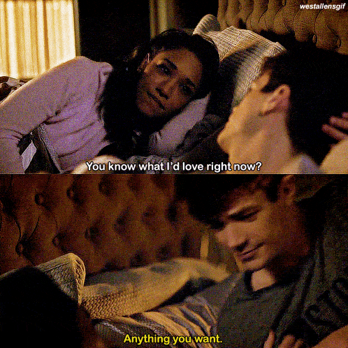 a man and a woman are laying on a bed and the woman says you know what i 'd love right now