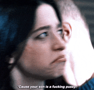 a close up of a woman 's face with the words " cause your son is a fucking pussy "