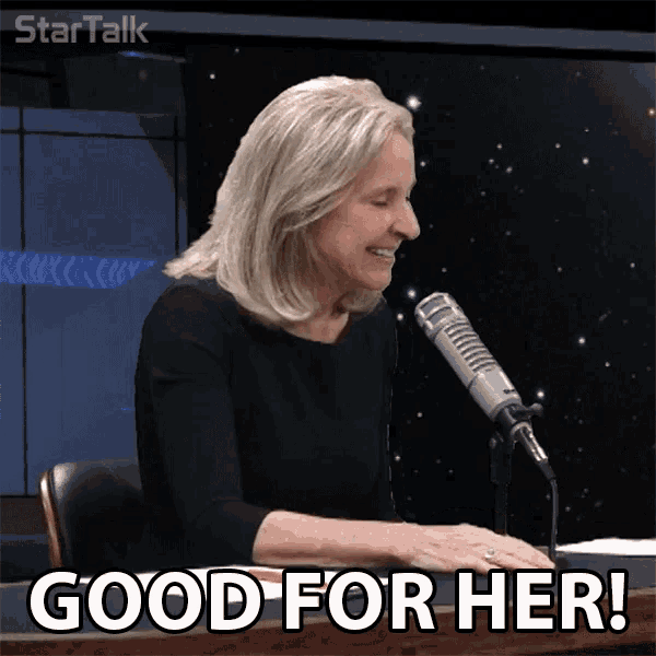 a woman sitting in front of a microphone with the words good for her on the bottom