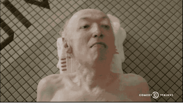 a man in a bathtub with a comedy central logo