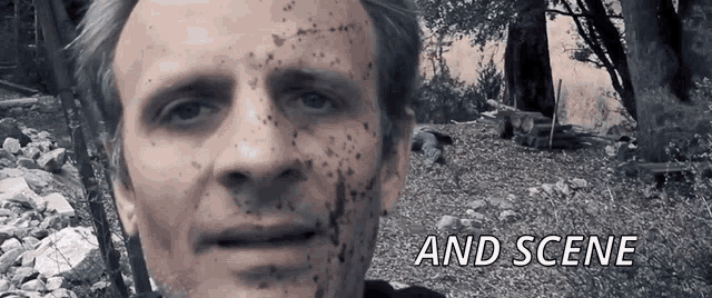 a close up of a man 's face with the words " and scene " below it