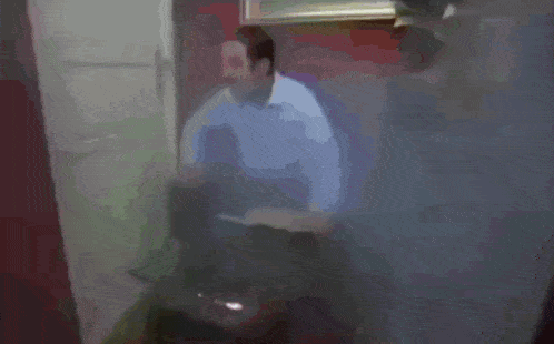 a blurry picture of a man standing in a doorway