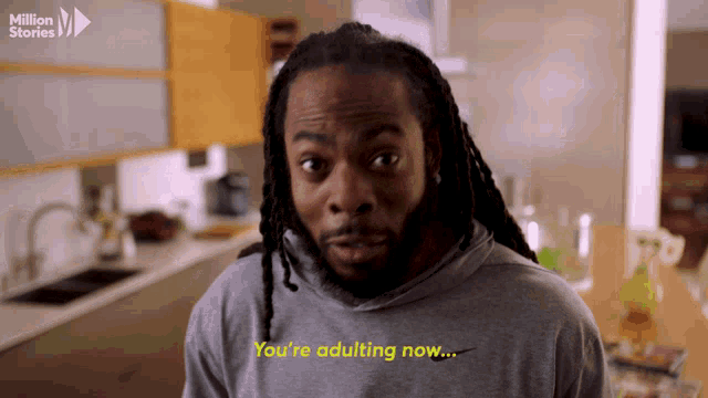 a man with dreadlocks says " you 're adulting now " in a kitchen