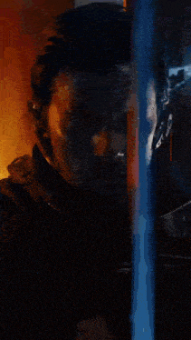 a blurred image of a man talking on a cell phone with the number 13 visible