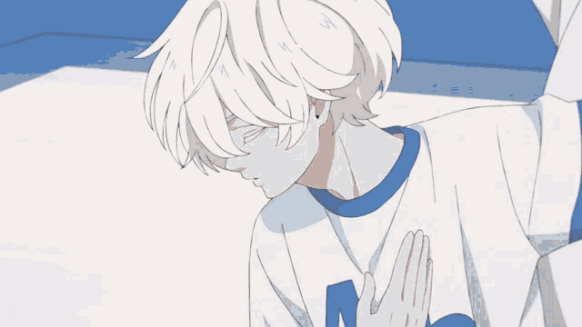 a boy with white hair is wearing a blue and white shirt with the letter m on it