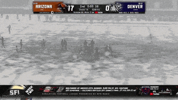 a football game between arizona and denver is being played in the snow