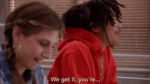 a man and a woman are sitting next to each other and the man is saying `` we get it , you 're . ''