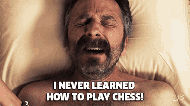 a man with a beard is laying on a bed with his eyes closed and says i never learned how to play chess