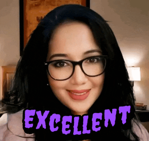 a woman wearing glasses is smiling with the words excellent above her