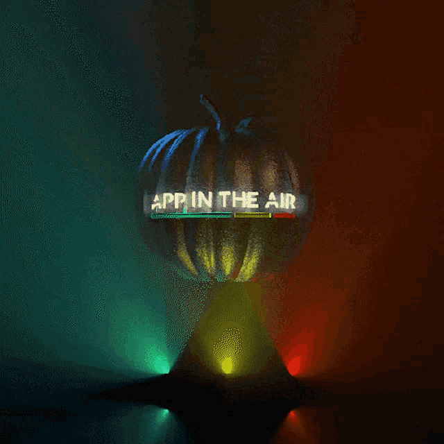 a pumpkin with app in the air on it