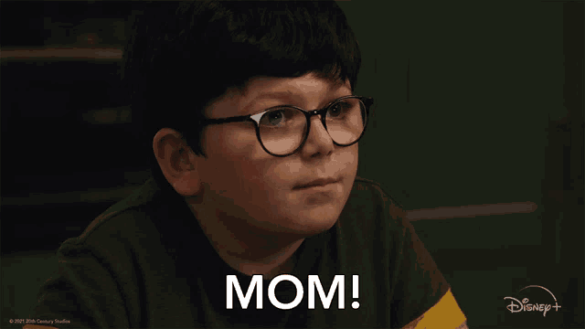 a young boy wearing glasses says mom in a disney+ advertisement