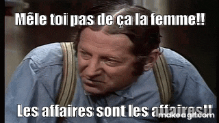 a man wearing suspenders and a blue shirt is making a funny face with a caption .